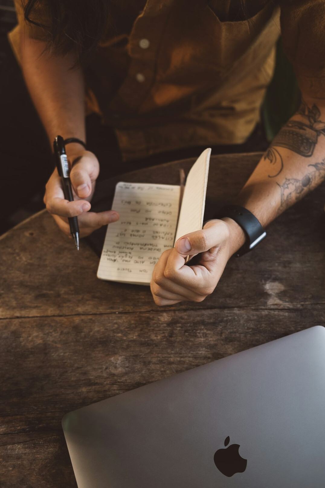 man writing goals