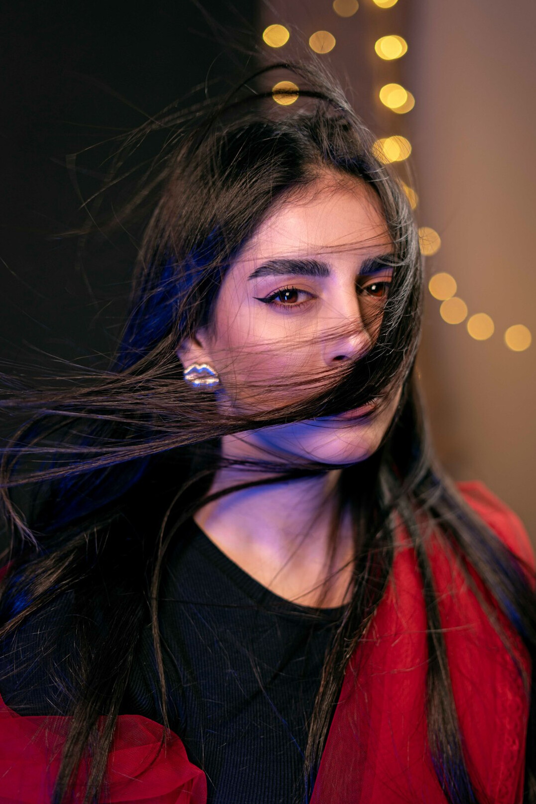 Portrait of a smiling young woman with long hair