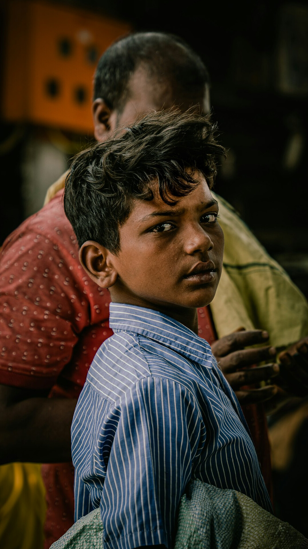Portrait of a man in a shirt looking at the camera